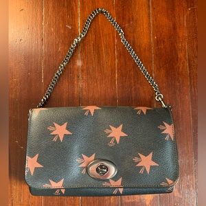 Black Coach should bag with brown stars and metal chain